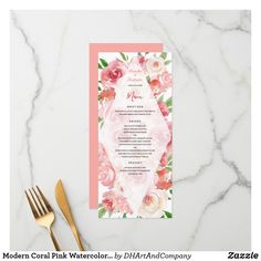 a wedding menu with pink flowers and greenery on the front, along with gold cutlery