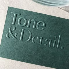 some type of business card that says tone and detail