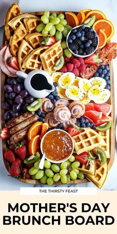 mother's day brunch board with fruit and waffles on it