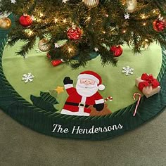 a christmas tree skirt with santa clause on it