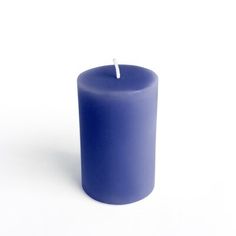 a blue candle with a white stick sticking out of it's center on a white background