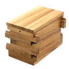 a wooden box with three drawers on it