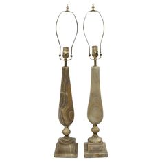 a pair of marble lamps with metal bases