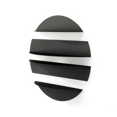 a black and white circular object on a wall