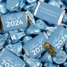 blue graduation hersheys with gold foil wrappers and congratulations stickers on them