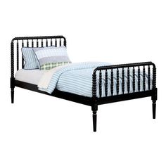 a black metal bed frame with blue and white striped pillows on the pillowcases