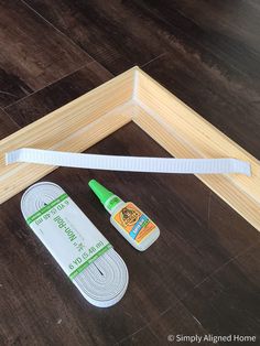 the supplies needed to make this diy photo frame are laid out on the floor