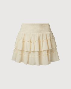 Ivory Flowy Ruffled Mini Skirt, Flowy Beige Tiered Mini Skirt, Beige Flowy Tiered Mini Skirt, Cream Ruffled Skirted Bottoms, Cream Ruffled Mini Skirt For Summer, Chic Tiered Mini Skirt With Elastic Waistband, Cream Mini Skirt With Ruffles For Summer, Cream Ruffled Flowy Bottoms, Vacation Mini Skirt With Ruffles