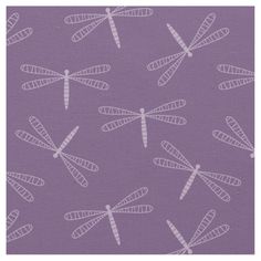 a purple background with white dragonflies on it