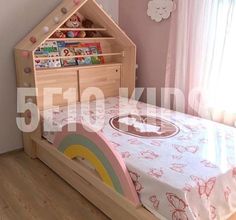 a child's bed with a book shelf in the shape of a house