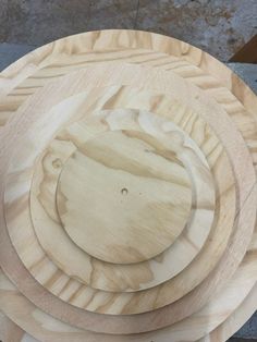 three wooden plates stacked on top of each other