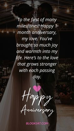 a man and woman kissing under an umbrella with the words happy anniversary written on it