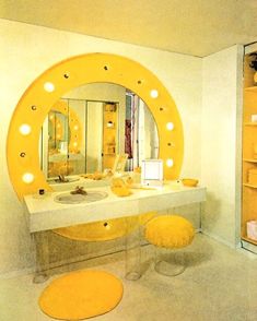 a bathroom with a vanity, mirror and stool in yellow colors on the floor next to it