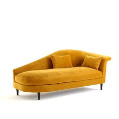 a yellow couch sitting on top of a white floor