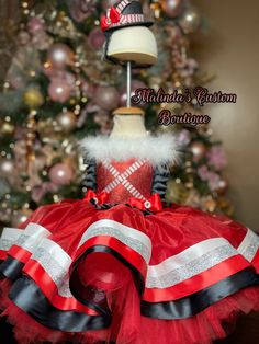 Ribbon trimmed tulle layered over fluffy tulle with sparkling top. Comes with Top hat headband to complete the look. Great for Christmas pictures, pageants, holiday parties and more. It's a show stopper and a pageant winning dress. Christmas Holiday Tutu Dress With Ruffles, Holiday Tutu Dress With Ruffles, Christmas Pageant Tutu Dress With Ruffles, Christmas Pageant Ruffled Tutu Dress, Winter Party Tutu Dress Made Of Tulle, Winter Party Tulle Tutu Dress, Christmas Festive Tutu Dress With Ruffles, Christmas Tutu Dress With Ruffles, Christmas Ruffled Tutu Dress