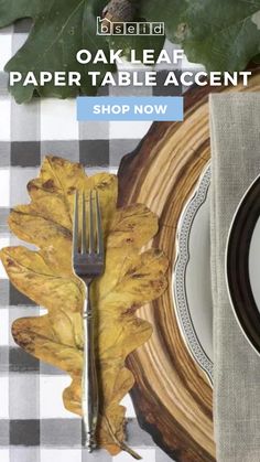 the oak leaf placemat is next to a plate with a fork and knife on it