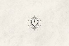 a drawing of a heart with rays coming out of it on a white paper background