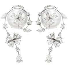 Presented by the acclaimed Designer Stefan Hefner, we are delighted to offer these exquisite and delicate Estate Earrings showcasing lustrous pearls adorned with brilliant diamonds. A floral motif, with movable flower accents - crafted in 18K White Gold and Italian made. Anchoring the earrings are a pair of 12mm High Luster South Sea Pearls of a beautiful soft silvertone and fine quality.  Surrounding each Pearl, (14) round Brilliant-Cut Diamonds, (18) Pear-Cut Diamonds & (4) Marquise-Cut Diamon Luxury Flower Shaped Engagement Earrings, Luxury Gold Flower Earrings Fine Jewelry, Luxury Fine Jewelry Clip-on Earrings, Luxury Flower Earrings With Diamond Accents For Wedding, Luxury Fine Jewelry Flower Earrings As Gift, Luxury Ornate White Earrings, Unique Luxury White Jewelry, Luxury Gold Flower Earrings In Fine Jewelry Style, Luxury Clip-on Fine Jewelry Earrings