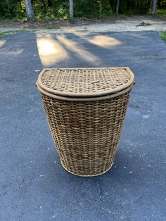 a wicker basket sitting on the ground