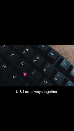 a black keyboard with the words u & i are always together