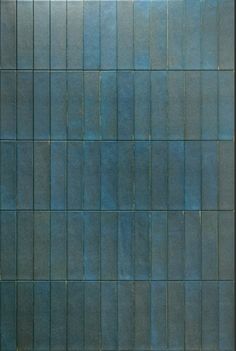 an image of a blue tile wall that looks like it has been painted