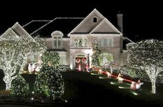 a large house covered in christmas lights