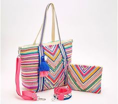 a multicolored handbag with matching purse and wrist strap