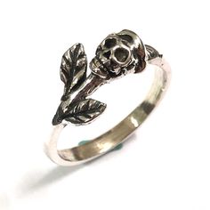 Skull with Rose Head Ring is made as a unique statement piece for skull lovers. This ring will be crafted and then oxidized into black and then polished finish. Base Material: Sterling Silver  Depth: 10mm (Approximately) Ring Size: US 5 - US 14 (Please select your size) Metal Stamped: 925 Thickness: 1.5mm / 0.059 Inch You'll receive an Order Shipped Email from us when your item is completed and shipped. SPECIAL ANNOUNCEMENT  1. Please visit https://www.etsy.com/shop/yhtanaff for more designs. 2. Edgy Silver Skull Ring As Gift, Edgy Silver Skull Ring For Gift, Edgy Skull Ring Gift, Gothic Adjustable Skull Promise Ring, Adjustable Gothic Skull Ring As A Gift, Adjustable Gothic Skull Ring, Edgy Skull Ring As A Gift, Edgy Skull Ring For Halloween Gift, Edgy Skull Ring For Halloween