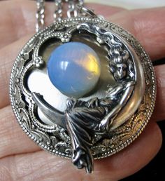 Moon Goddess Locket With a 12mm Opalite Stone. Victorian Moon - Etsy Silver Crescent Spiritual Jewelry, Spiritual Silver Crescent Jewelry, Vintage Moon Phase Jewelry, Antique Round Necklace With Moon Charm, Celestial Silver Oval Necklace, Spiritual Moon Shaped Silver Jewelry, Spiritual Moon-shaped Silver Jewelry, Spiritual Silver Moon Jewelry, Silver Celestial Oval Jewelry