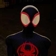 a spider man standing in the dark with his eyes closed