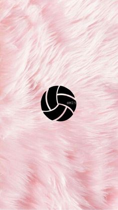 a volleyball ball on a pink fur background