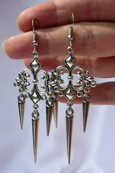 Victorian era earrings in silver color Silver Alloy Drop Clip-on Earrings, Nickel-free Alloy Earrings For Party, Nickel-free Alloy Drop Earrings, Alloy Drop Earrings With Ear Wire, Ornate Sterling Silver Earrings With Elegant Design, Elegant Nickel-free Alloy Jewelry, Elegant Metal Earrings For Gift, Formal Alloy Drop Earrings, Pierced Alloy Jewelry For Party