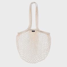 a white net bag hanging from the side