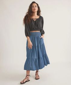 Corinne Chambray Maxi Skirt – Marine Layer Flowy Full Skirt For Day Out, Chic Gathered Skirt For Brunch, Flowy Full Skirt For Brunch, Chic Relaxed Fit Tiered Skirt, Chic Voluminous Tiered Skirt Bottoms, Casual Voluminous Maxi Skirt For Day Out, Bohemian Midi Skirt For Brunch, Chic Full Skirt Bottoms For Brunch, Chic Full Maxi Skirt For Vacation