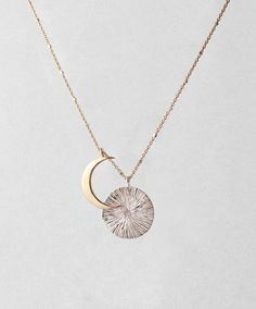 Featuring a gold crescent moon eclipsing an engraved sterling silver disc, the Eclipse Necklace is made for the lovers of the night sky.   IZA Jewelry | www.izajewelry.com Gold Crescent Sterling Silver Jewelry, Silver Half Moon 14k Gold Jewelry, Celestial Half Moon Gold Jewelry, Elegant Crescent Coin Pendant Jewelry, Half Moon 14k Gold Jewelry, Elegant Crescent Shaped Hammered Jewelry, Minimalist Etched Gold Jewelry, Celestial 14k Gold Engraved Jewelry, Celestial Crescent Engraved Jewelry