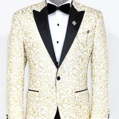 Gold And Ivory Floral Jacket. Single Button Peak Lapel In A Slim Fit. Coat Only. Designer White Blazer For Semi-formal Occasions, Gold Single Breasted Blazer For Wedding, Elegant Gold Suits For Winter, Gold Single-breasted Suits With Long Sleeves, Luxury Gold Blazer With Lapel Collar, White Single Button Luxury Blazer, Gold Fitted Long Sleeve Suit, Cream Sport Coat For Spring Formal, Luxury White Single Button Blazer