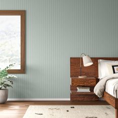 a bedroom with blue walls and wooden furniture in the corner, along with a rug on the floor