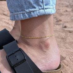 Bare ankles no more. Let this small but mighty anklet take your summer looks to another level. Handcrafted in 14k gold filled, this dainty Satellite Beaded Anklet is perfect for your regular rotation of stackers. From our Capsule Collection which effortlessly fuses simple, easy-to-wear designs with a sophisticated edge. 10% from the sale of this item will be donated to Marine Conservation Society via Work for Good, so you can look great and feel great at the same time! ~ DESIGN ~ Made in 14k gol Adjustable Beaded Chain Anklet As Gift, Ankle Wrap Anklets With Tiny Beads For Gifts, Dainty Adjustable Beaded Chain Anklets, Minimalist Gold Beaded Anklets, Work For, Anklet Gold, Beaded Ankle Bracelets, Beaded Ankle, Beaded Anklet