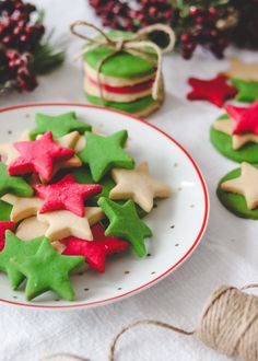 decorated cookies on a plate with twine spools