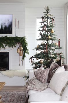 a living room with a christmas tree in the corner