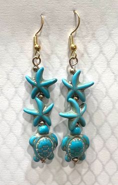 Stone starfish and sea turtle earrings with gold plated fishhook ear wire closure. Light weight. The perfect accessories for those tropical beach getaways! Dangle Earrings With Ear Wire For Vacation, Gold Dangle Earrings For Beach Season, Summer Starfish Charm Dangle Earrings, Summer Dangle Earrings With Starfish Charm, Nickel-free Dangle Earrings For Vacation, Nickel Free Dangle Earrings For Vacation, Nickel-free Drop Earrings For Vacation, Adjustable Drop Earrings For Vacation, Summer Starfish Charm Drop Earrings