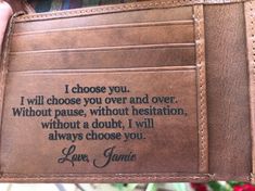 a person is holding a wallet with a quote on the card holder that says i choose you, i will choose you over and over without pause, without