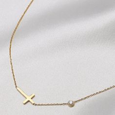 Embrace timeless elegance with our Faith Sideways Cross Necklace. Simple, sophisticated design for any occasion. Fine craftsmanship for a touch of grace in your ensemble. A tasteful and exclusive piece, perfect for expressing your faith and devotion. 16" - 18" cable chain. Ships within 24 hours from Akron, Ohio. Cross Necklace Simple, Sideways Cross Necklace, Cross Necklace Sideways, Faith Cross, Akron Ohio, Gold Cross Necklace, Necklace Simple, Sophisticated Design, Drop Necklace