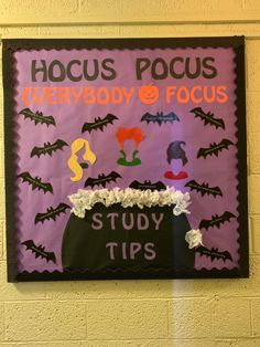 a bulletin board with bats and flowers on it that says hoccus pocus everybody & focus study tips