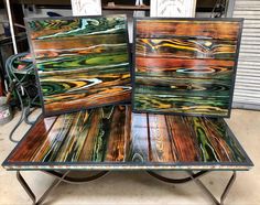 two tables made out of wood with different colors and designs on the top one is metal