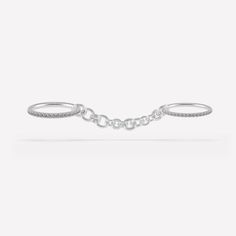 Integrating elements of our classic full round bands and contemporary chains, the Indus Silver Ring displays an all-new, unique silhouette entirely constructed in .925 sterling silver with optional gray diamonds. Meant to be worn across multiple fingers, this style features two anchoring bands in staggered sizes that amplify the elegant drapery of our multi-gauged Helio Chain. The Indus Silver Ring is available in select sizing combinations and is perfect for integrating with your favorite Spine Elegant Draperies, Shimmer Shine, Ring Displays, Grey Diamond, New Jewelry, Ring Sizer, Sterling Silver Bands, Silver Band, Silver Ring