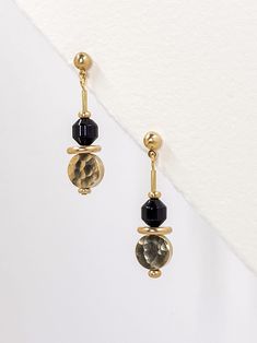 These earrings feature simple but strong geometric shapes.  The polished, semi precious, black agate stone is facet cut to create a hexagonal shape that reflects the light. A solid, golden brass disk sits horizontally underneath and a hammered, coin shaped circle balances the design.  The contrast of smooth, polished and hammered textures and bold shapes make these earrings striking and interesting.  A solid brass ball stud with stainless steel earring post holds the earrings at the top.  Approx Set Theory, Black Agate Stone, Dangle Earrings Gold, Black Minimalist, Gold Dangle Earrings, Stone Gold, Earrings Black, Gold Brass, Earrings Statement