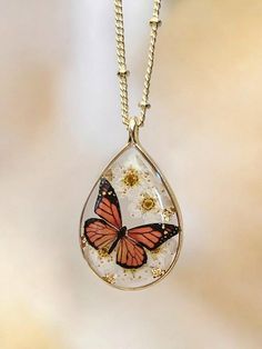 a necklace with a butterfly on it