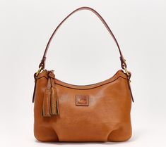 Crafted of rich Florentine leather, this pouchette bag boasts a classic design that will never go out of style. Carry this timeless treasure for seasons to come. From Dooney & Bourke. Elegant Shoulder Bag With Brass Hardware, Elegant Smooth Grain Pouch Shoulder Bag, Elegant Cognac Pouch Shoulder Bag, Elegant Cognac Bags With Brass Hardware, Dooney And Bourke, Dooney Bourke Handbags, Dooney & Bourke Bags, Dooney & Bourke, Hobo Handbags