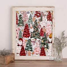 a painting with christmas trees and santa clauss on it, sitting next to a potted plant